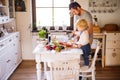Young father with a toddler boy cooking. Royalty Free Stock Photo