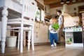 Young father with a toddler boy cooking. Royalty Free Stock Photo