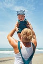 Young father tossing up to mid air happy baby boy Royalty Free Stock Photo