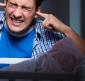 Young father under stress due to baby crying at night Royalty Free Stock Photo