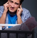 Young father under stress due to baby crying at night Royalty Free Stock Photo