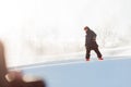 Young fearful man practising snowboarding. first eperience. Royalty Free Stock Photo
