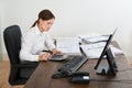 Accountant Doing Calculation At Desk Royalty Free Stock Photo