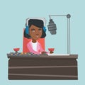 Young female african-american dj working on radio.