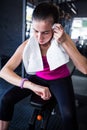 Young female athlete checking time in gym Royalty Free Stock Photo