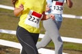 Young female athletic runners on a race. Outdoor circuit