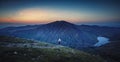 Young Female Backpacker Walking on Rocky Footpath at the Top of Royalty Free Stock Photo