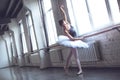 Young ballet dancer practice bend in studio active lifestyle