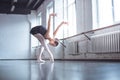 Young ballet dancer bend down in studio active lifestyle Royalty Free Stock Photo