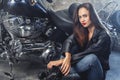 Young woman with motorcycle studio