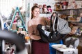 Young female with car cradle for infant Royalty Free Stock Photo