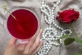 Young female caucasian hand holding a martini with olives, closeup, top view Royalty Free Stock Photo