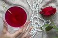 Young female caucasian hand holding a martini with olives, closeup, top view Royalty Free Stock Photo