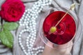 Young female caucasian hand holding a martini with olives, closeup, top view Royalty Free Stock Photo