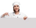Young female chef with blank poster on white background