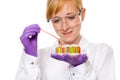 Young female chemist doing some research, isolated Royalty Free Stock Photo