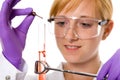 Young female chemist doing some research, isolated Royalty Free Stock Photo