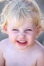 Young female child or toddler with cheeky grin on her face