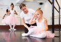 Ballet teacher comforting tired little ballerina Royalty Free Stock Photo