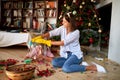 Young female cleaning glasses bell