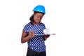 Young female construction engineer reading notes on clipboard Royalty Free Stock Photo