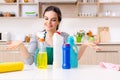 Young female contractor doing housework Royalty Free Stock Photo