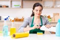 Young female contractor doing housework Royalty Free Stock Photo