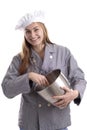 Young female cook with big smile mixing food