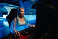 Young female cyber gamer, cosplayer plays computer games.