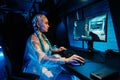 Young female cyber gamer, cosplayer plays computer games.