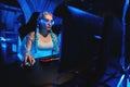 Young female cyber gamer, cosplayer plays computer games.