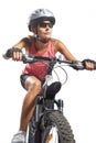 Young female cycling athlete riding mountain bike and equipped w