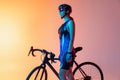 Cyclist riding a bicycle  against neon background Royalty Free Stock Photo