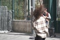 Young female dancing outdoors to a street music