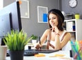 Young female designer using graphics tablet while working Royalty Free Stock Photo