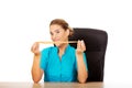 Young female dietician holding measure tape