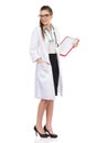 Young Female Doctor With Clipboard Looking Over Shoulder Royalty Free Stock Photo