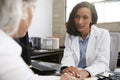 Young female doctor in consultation with senior patient Royalty Free Stock Photo