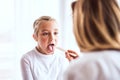 Young female doctor examining a small girl in her office. Royalty Free Stock Photo