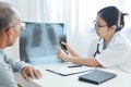 Young female doctor examining x-ray film. Royalty Free Stock Photo