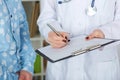 Young female doctor explaining diagnosis to her male patient. Royalty Free Stock Photo