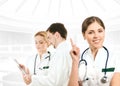 A young female doctor in front of her team Royalty Free Stock Photo