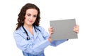 Young female doctor holding a blank Royalty Free Stock Photo