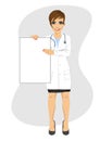 Young female doctor holding empty blank board Royalty Free Stock Photo