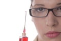 Young female doctor holding a syringe Royalty Free Stock Photo