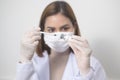 Young female doctor holding a syringe with covid-19 vaccine bottle for injection, covid-19 vaccination and health care concept Royalty Free Stock Photo