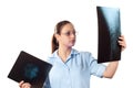 Young female doctor looking at x-ray picture Royalty Free Stock Photo