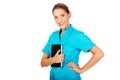 Young female doctor or nurse holding black notes Royalty Free Stock Photo