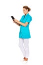 Young female doctor or nurse holding black notes Royalty Free Stock Photo