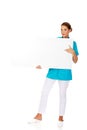 Young female doctor or nurse holding empty banner Royalty Free Stock Photo